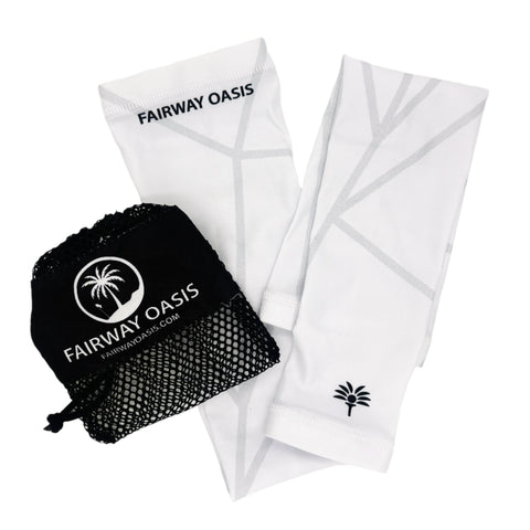 White arm sleeves with black travel bag featuring 'Fairway Oasis' branding on a white background.
