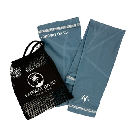 Ocean Blue arm sleeves and black travel mesh bag with 'Fairway Oasis' branding on a white background