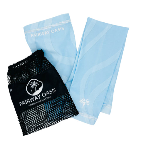 Light blue arm sleeves with black mesh bag featuring 'Fairway Oasis' logo on a white background
