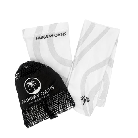 White and Grey arm sleeves with travel black mesh bag with 'Fairway Oasis' branding on a white background